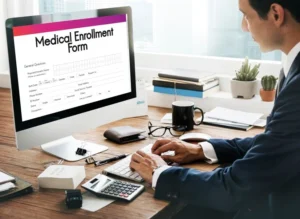 Computer screen displaying medical employment form for insurance credentialing services.