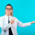 A woman wear a wihte coat and sunglasses stand with board discuss about the BPH ICD-10 codes.