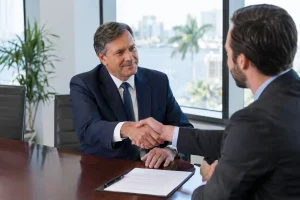 Senior male administrator reviewing medical billing transition contract in Florida office