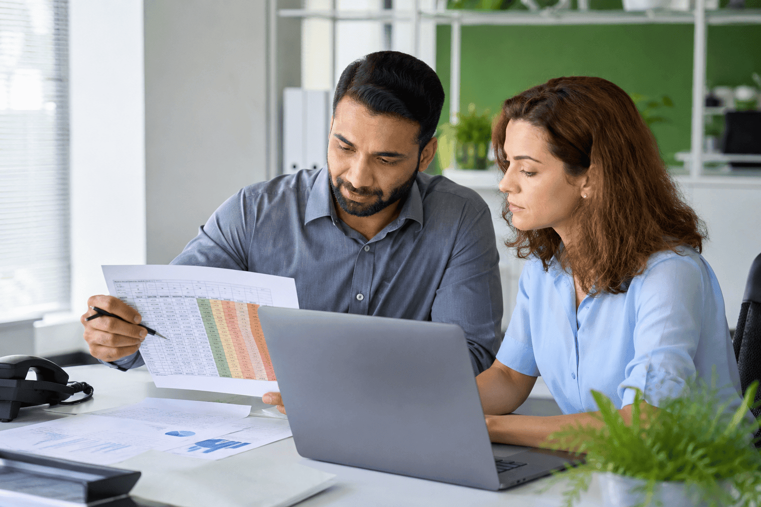 medical billing team reviewing accounts receivable aging report
